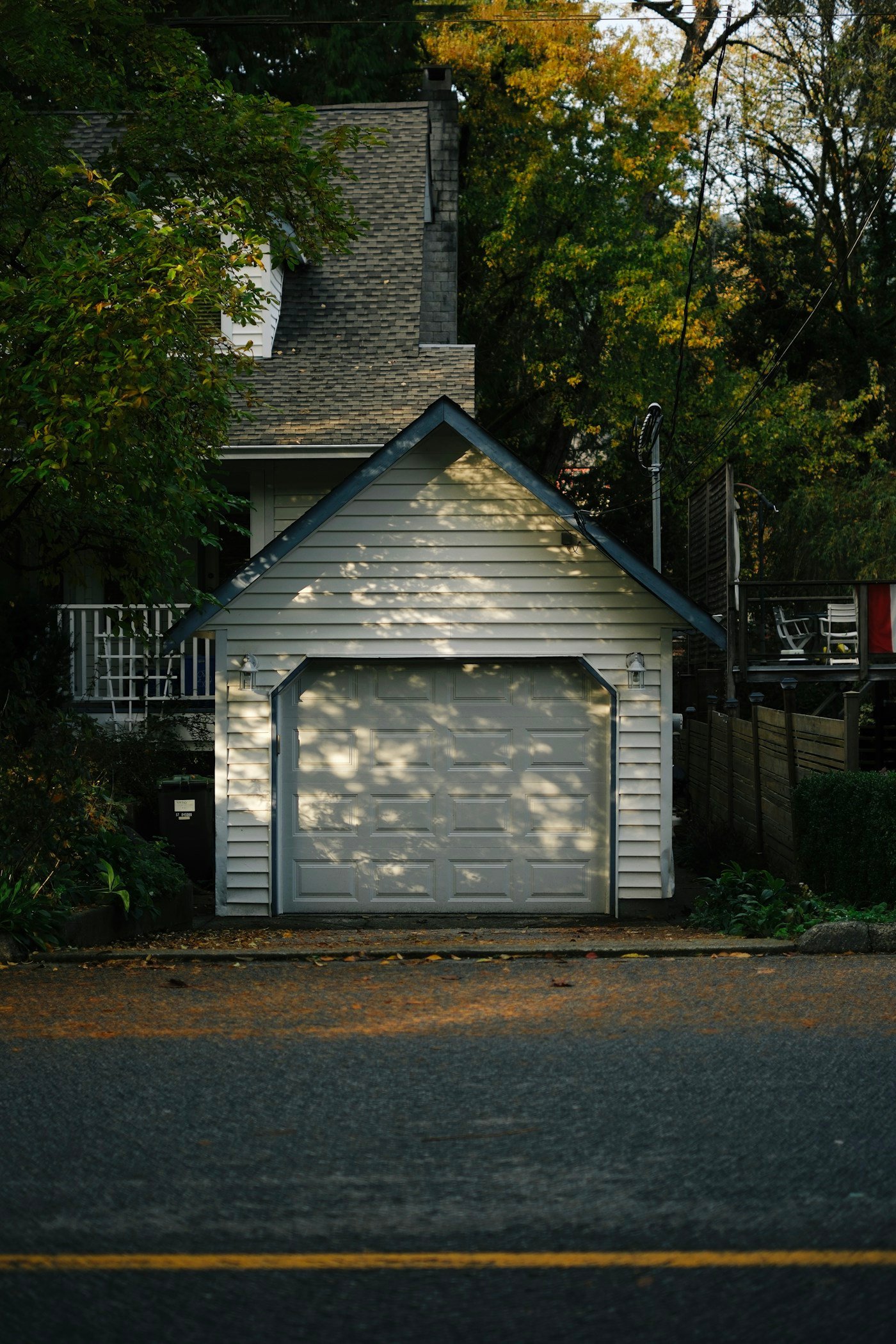 White raised-panel residential garage door